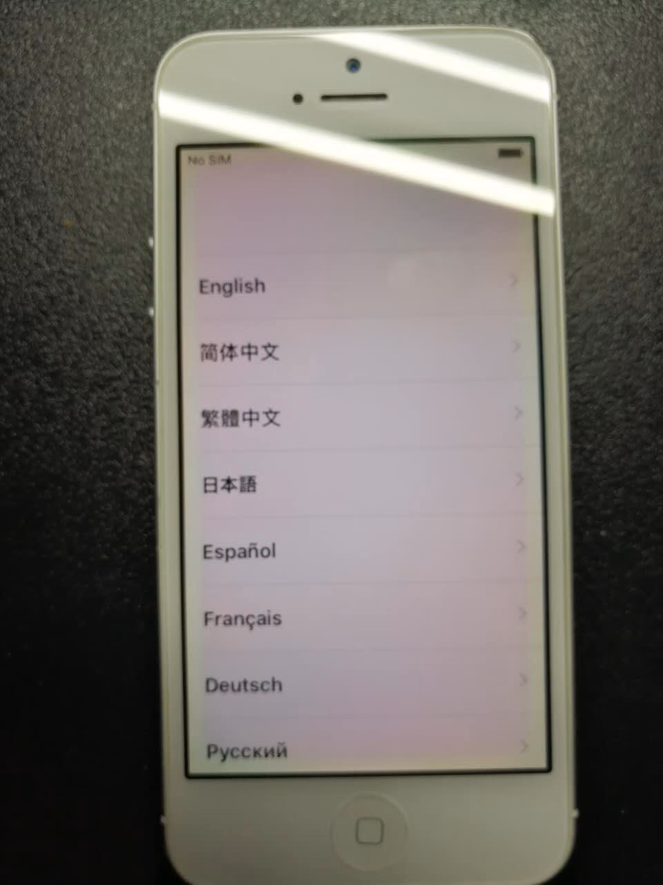 How to fix yellow dot on iPhone screen?